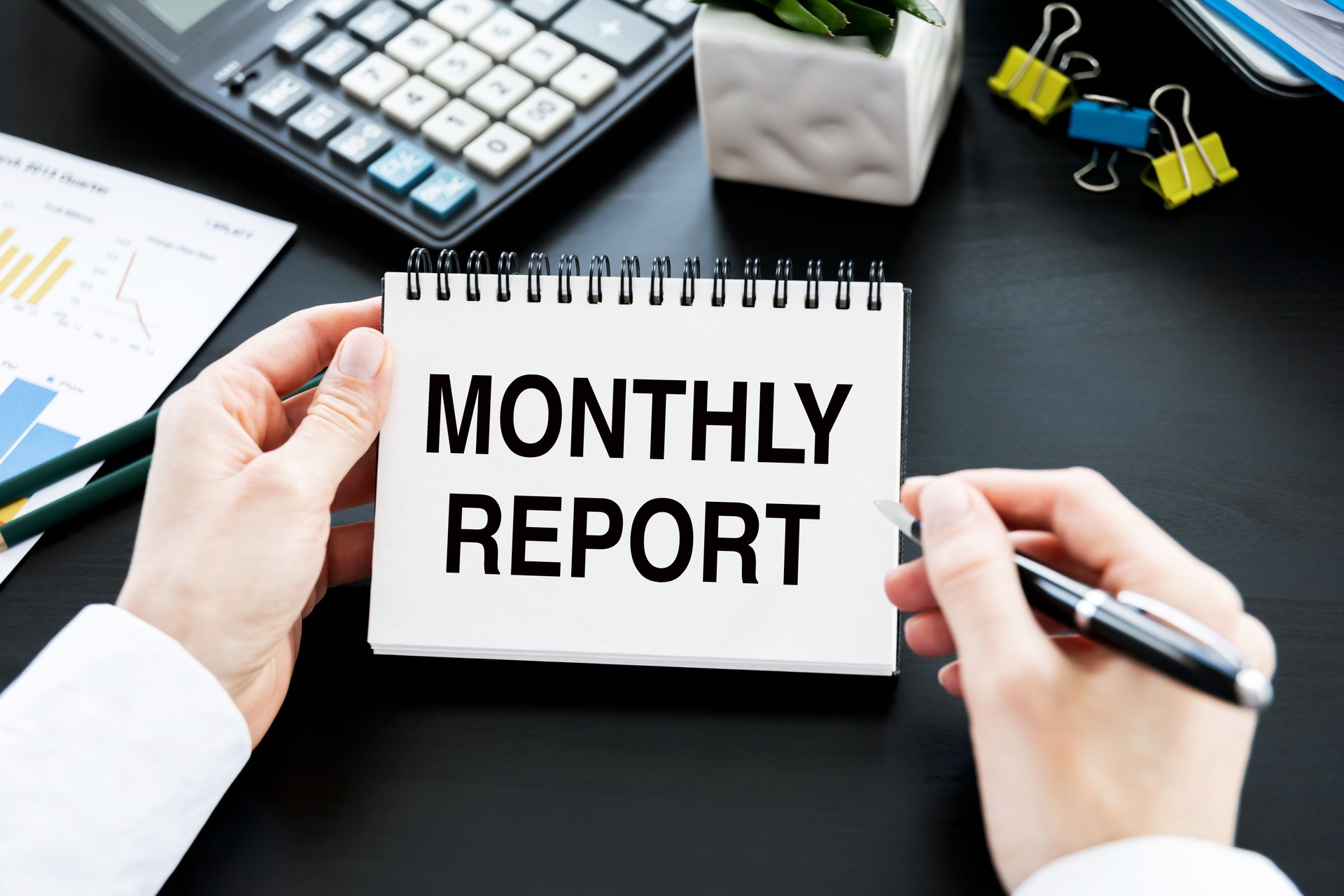 Business card with text Monthly Report with, glasses, pen and calculator. Financial concept